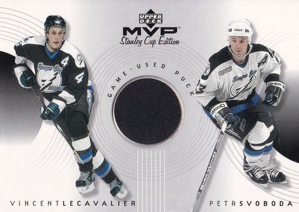 puck karta LECAVALIER/SVOBODA 99-00 MVP SCE Game-Used Puck číslo GC-LS